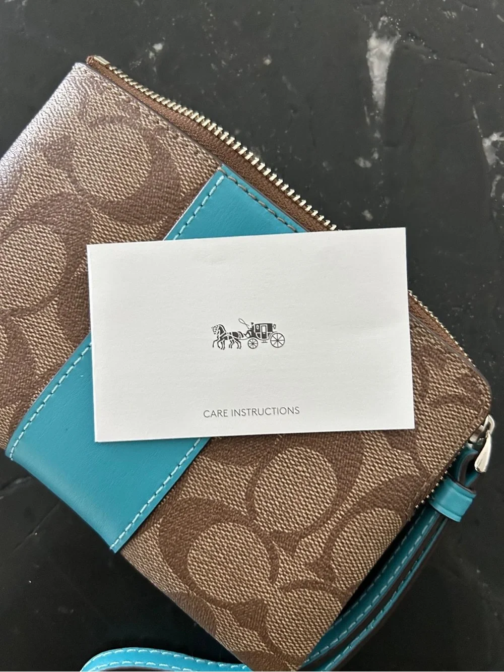 Coach Brown Signature Canvas Wristlet with Turquoise Accent
